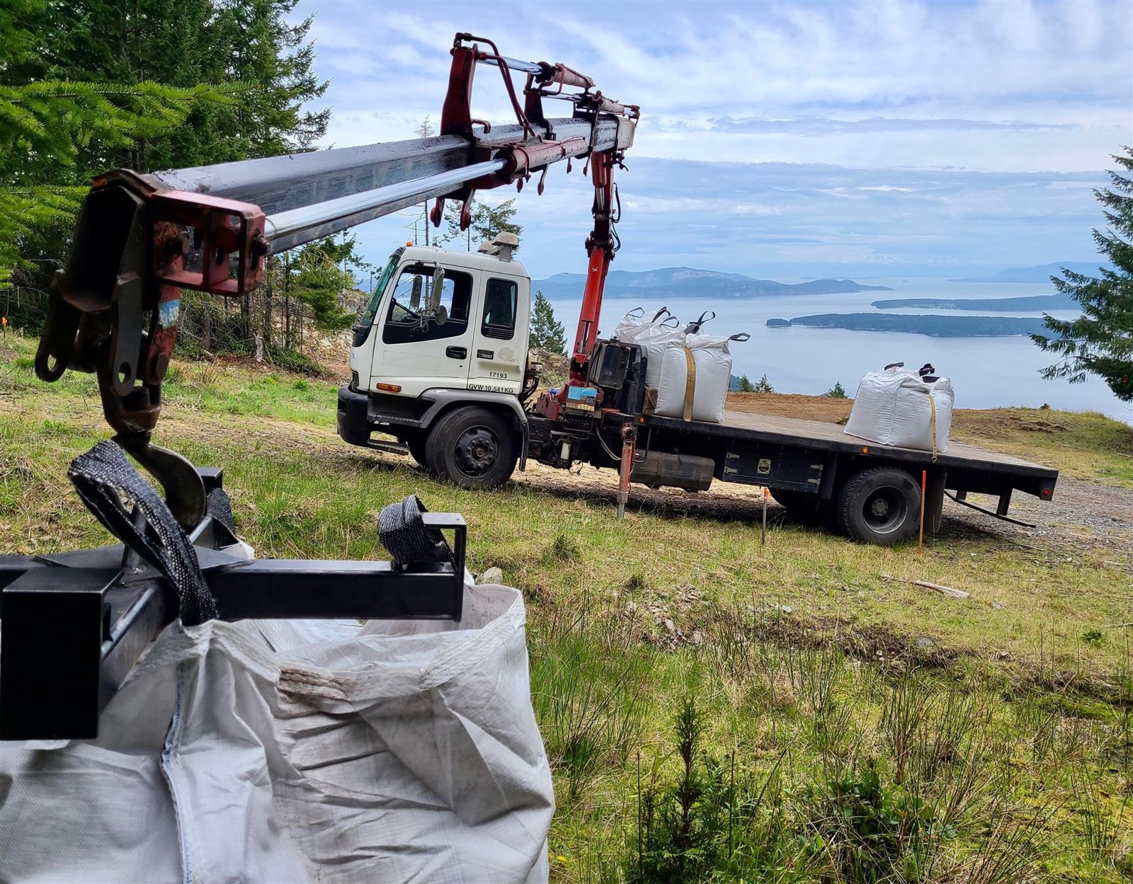Steffich Transport crane truck with bulk bags, overlooking the ocean