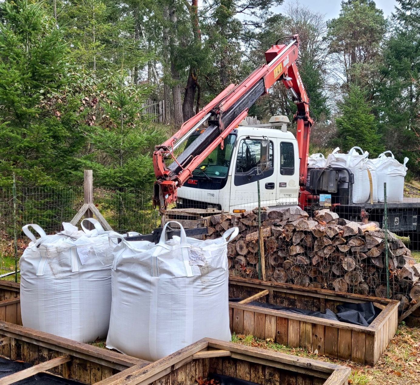 Bulk bags of garden soil in raised beds