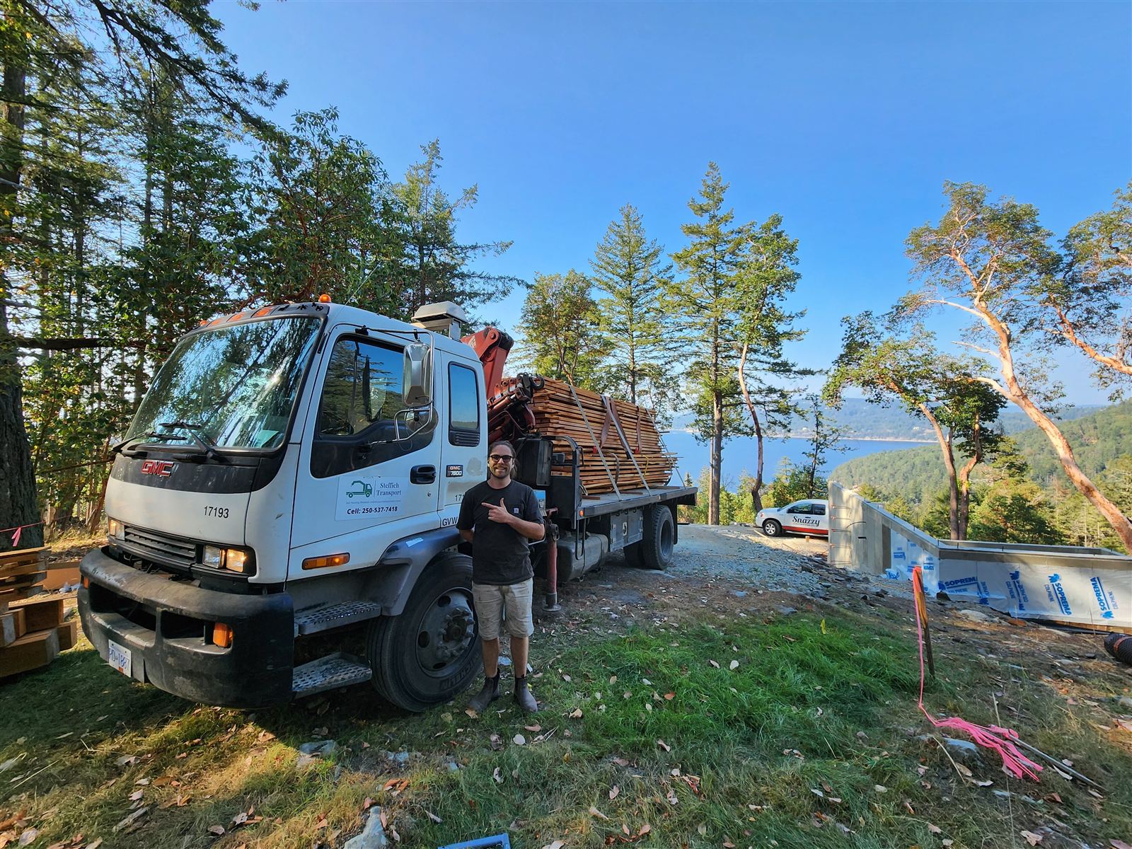 Steffich Transport truck loaded with lumber on a sunny day